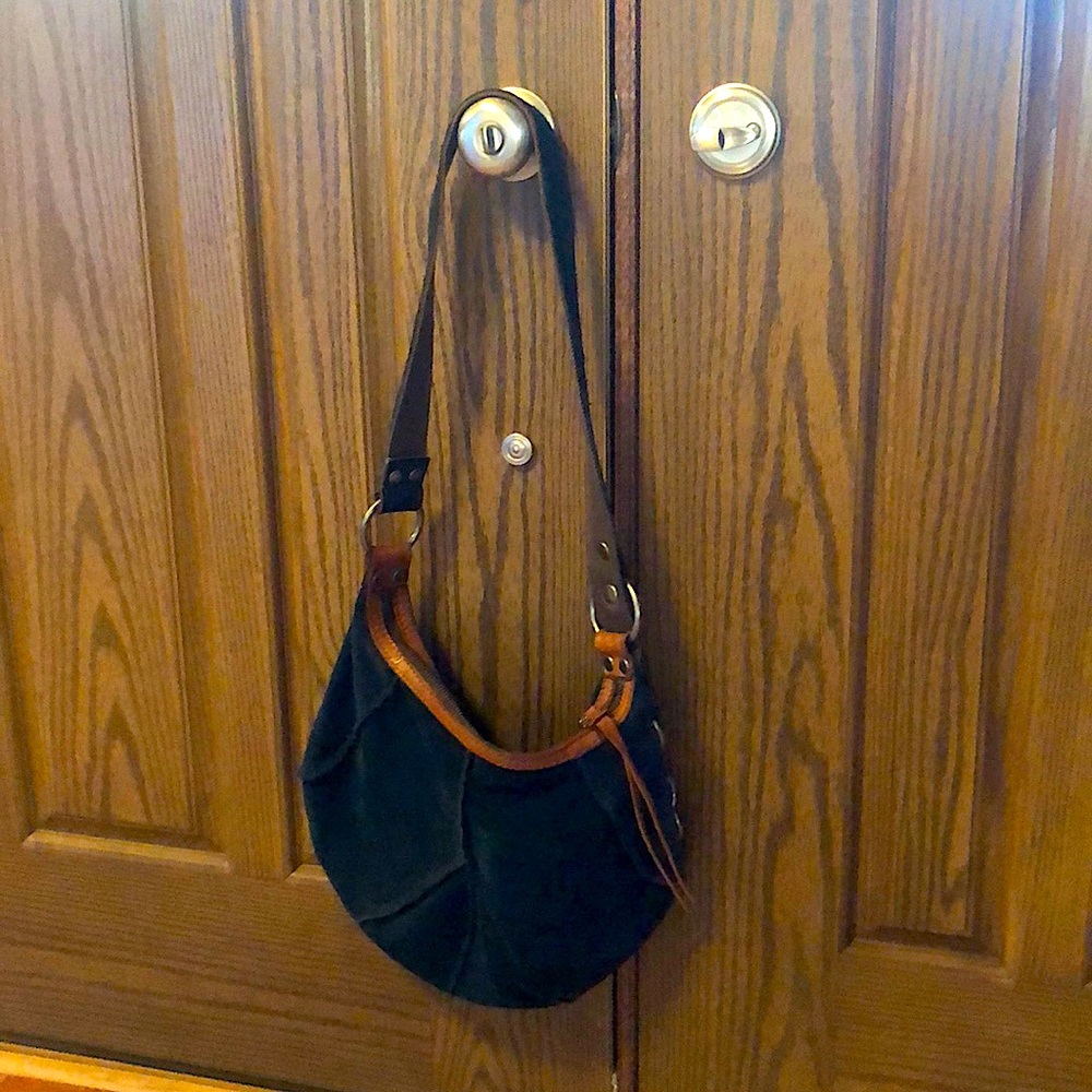 It was worn a few times .It is navy suede leather hobo .